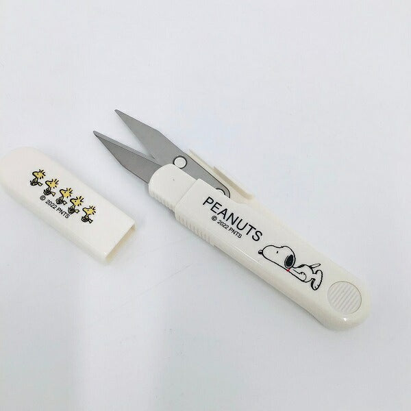 Snoopy handy scissors with the cap on, showing the Woodstock print on the handle