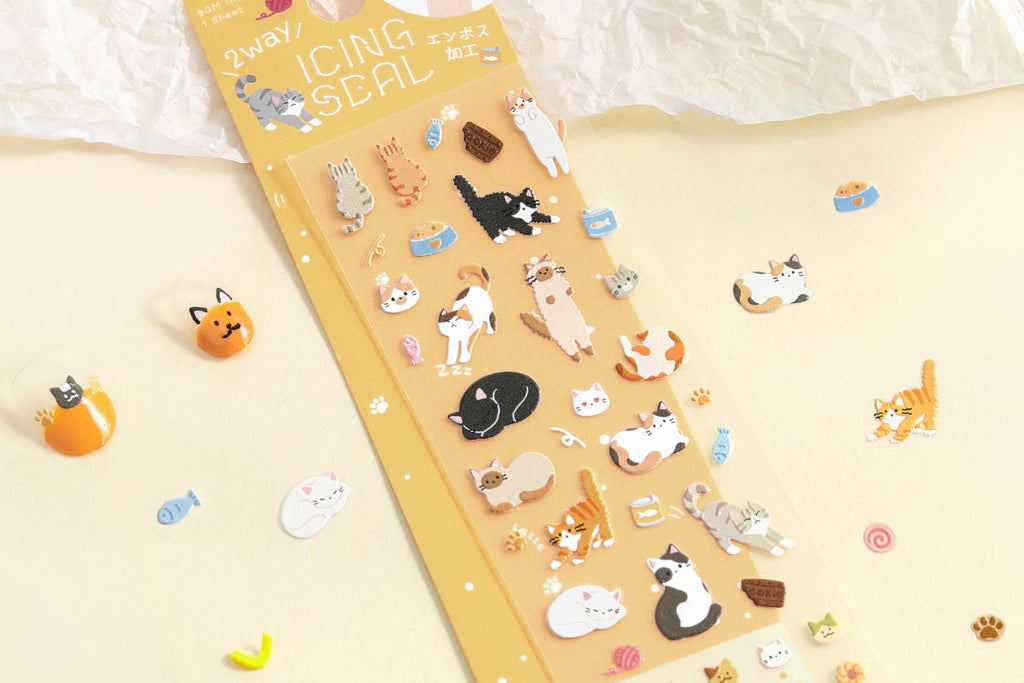 BGM icing seal sticker sheet, Cat Days design with embossed cats curled up around cups, stickers and small household objects