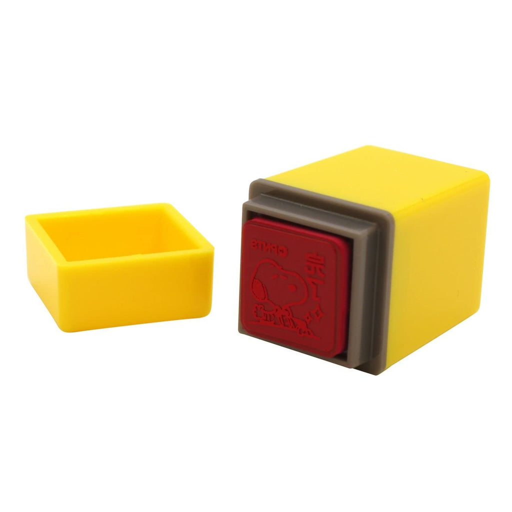 Base of a Kodomo no Kao Snoopy mini stamp opened to show the pink pigment ink pad inside