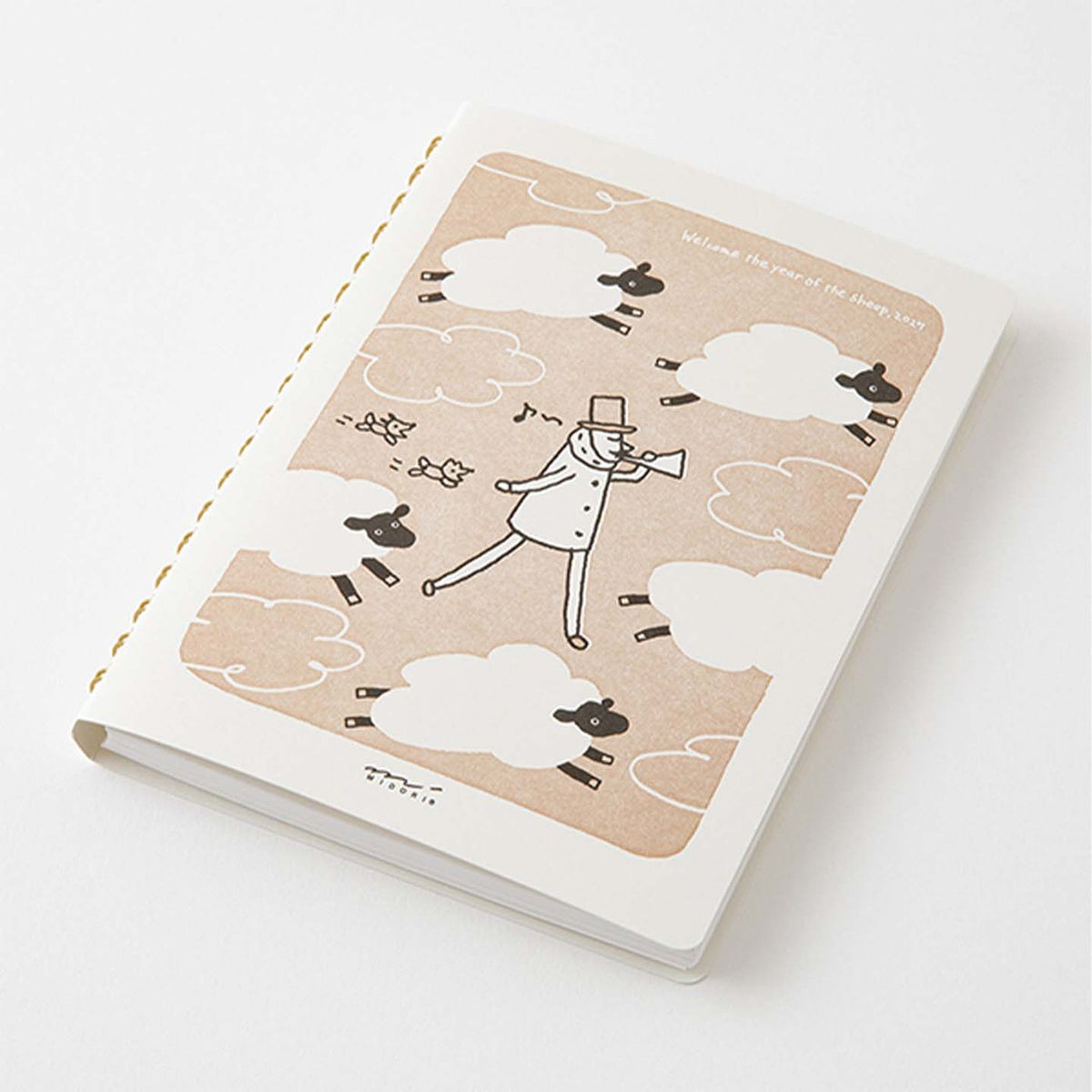 MIDORI Ojisan B6 ring notebook standing on a white background with letterpress cover