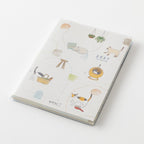 MIDORI Pocket Diary 2027 A6 cat planner open showing monthly pages and a cat drawing