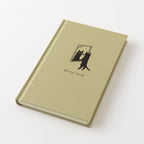 MIDORI Book Style Diary 2027 beige cat planner lying open next to its cloth cover