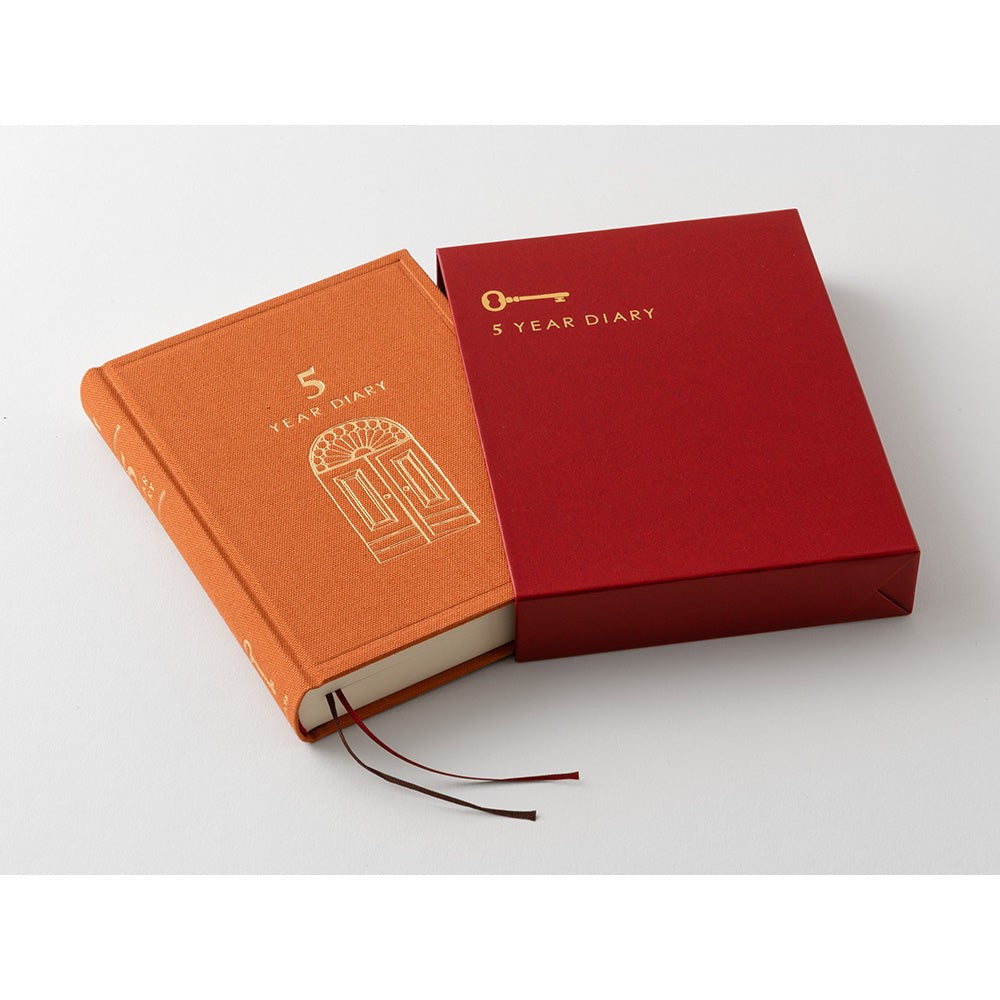 MIDORI 5 Year Diary Gate Mini red diary open beside its matching case