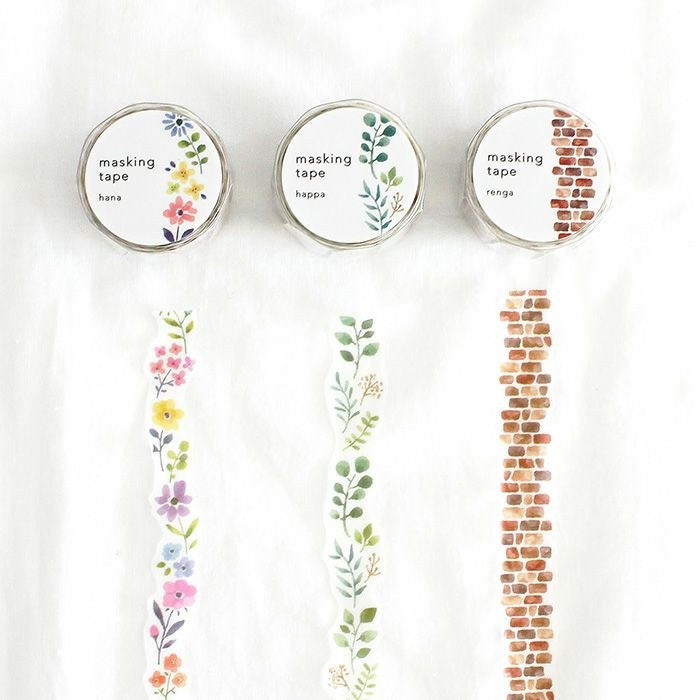 Three MIND WAVE die-cut masking tape rolls with their printed vertical strips