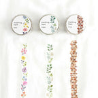 Three MIND WAVE die-cut masking tape rolls with their printed vertical strips